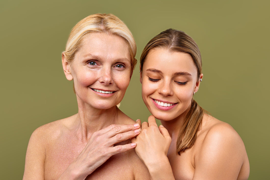 Smiling midlife woman with radiant skin standing beside younger woman, representing collagen support and skin confidence at every age.
