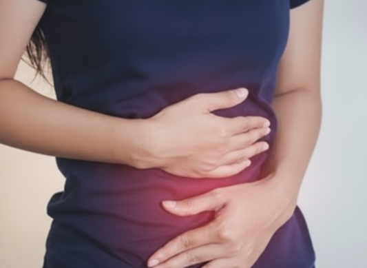 Woman holding her bloated stomach