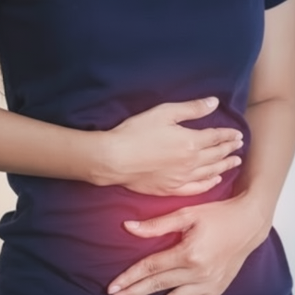 Woman holding her bloated stomach